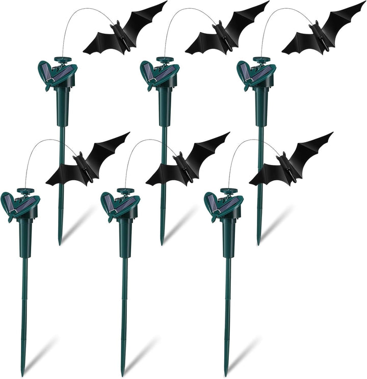 Set of Halloween bat decorations on sticks against a white background