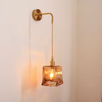 Antique brass wall sconce with warm LED light for modern bedroom décor