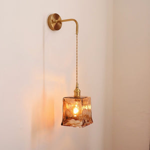 Antique brass wall sconce with warm LED light for modern bedroom décor
