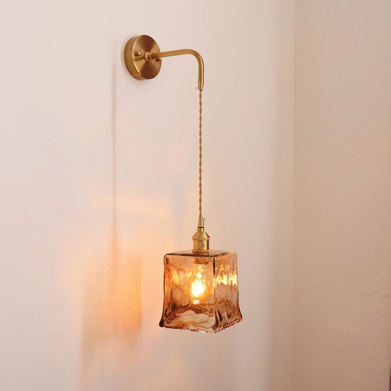 Antique brass wall sconce with warm LED light for modern bedroom décor