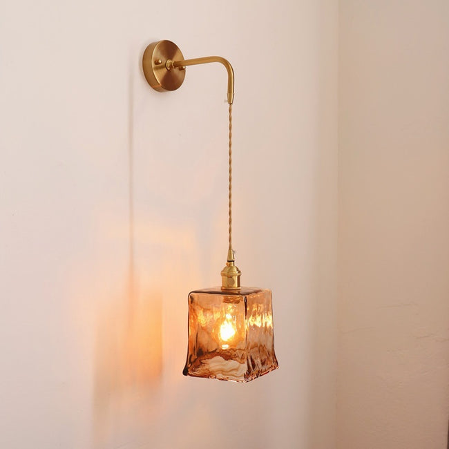 Antique brass wall sconce with warm LED light for modern bedroom décor