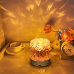 Modern crystal lamp illuminating dining table with ripple projection