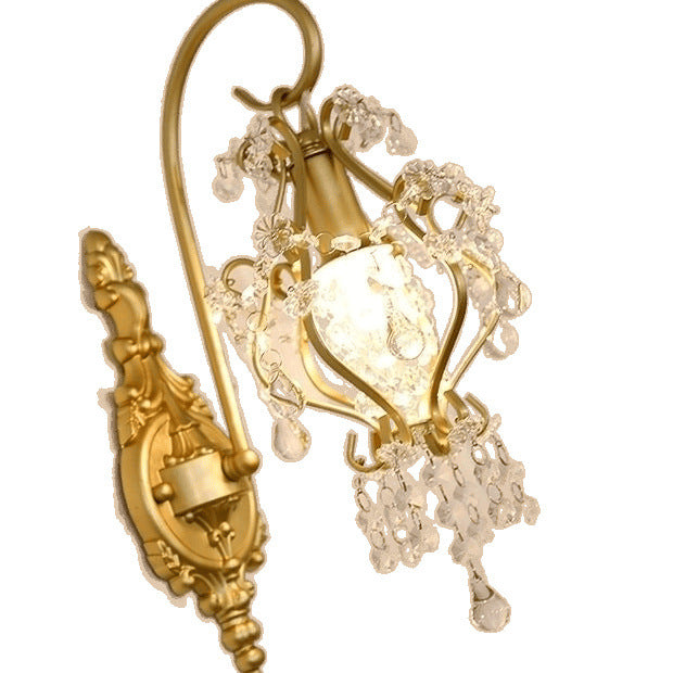 Gold earrings with intricate designs on a white background