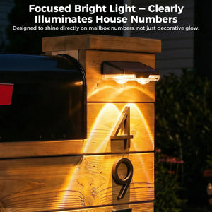 Solar mailbox light illuminating house numbers on a wooden post with text about its brightness.