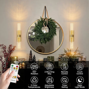 Round mirror with decorative wreath, wall sconces, and remote control with features displayed.