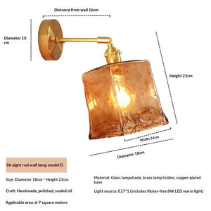 Nordic antique brass wall light fixture mounted beside a contemporary bed