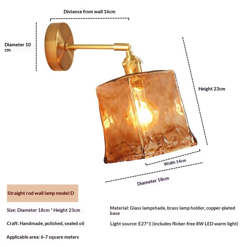 Nordic antique brass wall light fixture mounted beside a contemporary bed