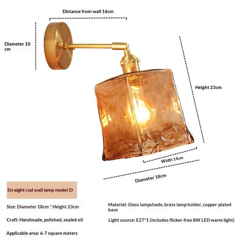 Nordic antique brass wall light fixture mounted beside a contemporary bed