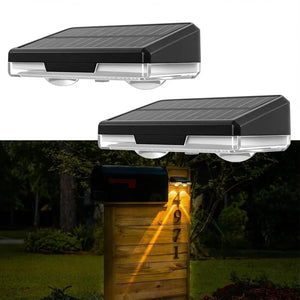 Solar-powered outdoor light fixture on a wooden post with a dark background